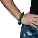 Handcrafted beaded ball bracelet featuring vibrant beads and gold-toned accents, elegantly designed for a stylish and unique look.