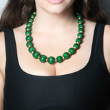 Handcrafted beaded ball necklace featuring vibrant beads and gold-toned accents, elegantly designed for a stylish and unique look.