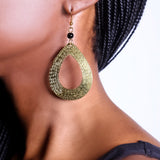 Striking tear-drop brass earrings. Handcrafted with care and attention to detail, these earrings will add a special touch of style and flair to your look.