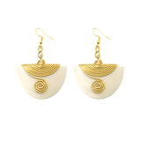 The Enzi earrings are handmade with love. They are lightweight and made from repurposed material. Perfect for any occasion.