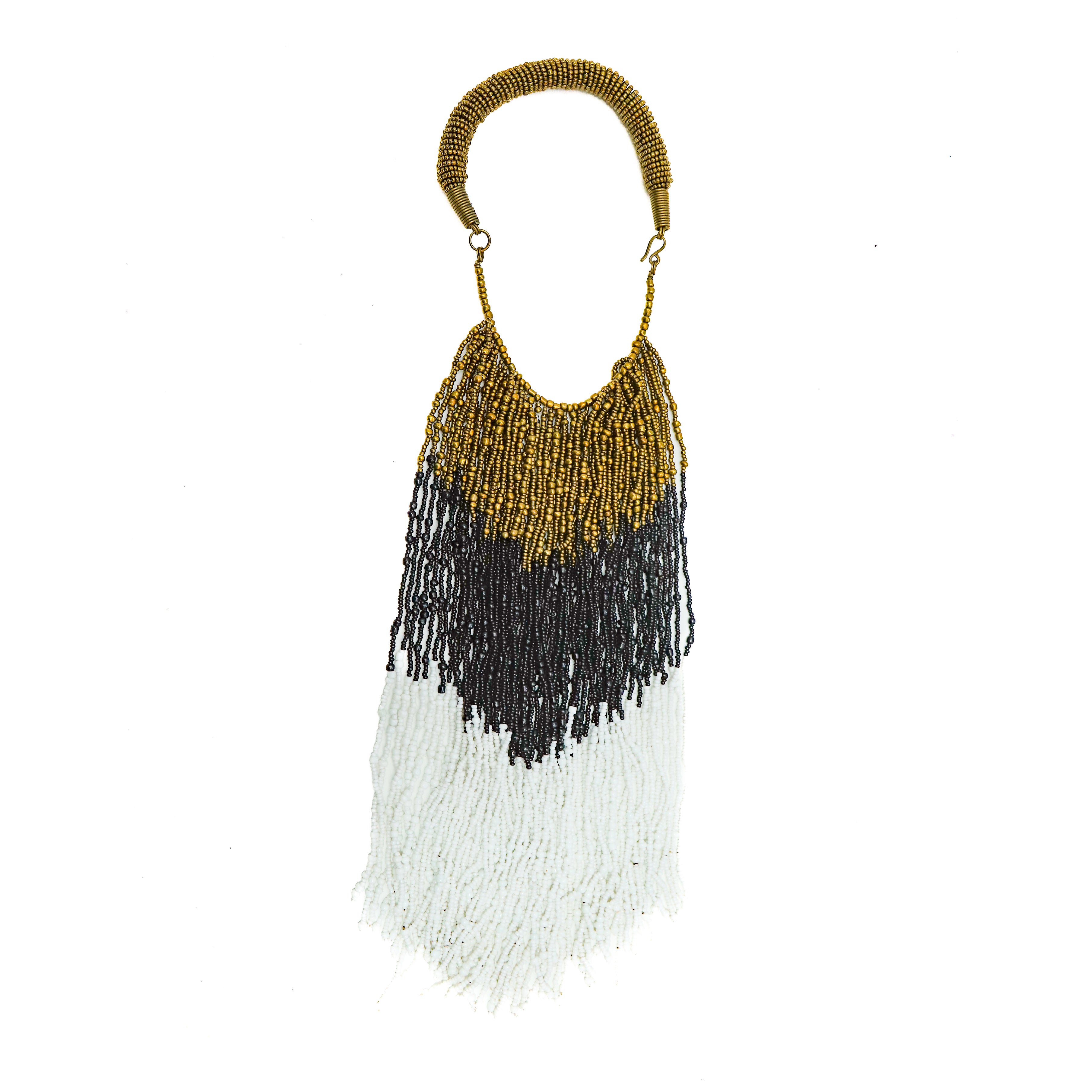 A celebration of color and beadwork. Each bead is strung by hand, creating a joyful dance of cascading beads. A versatile statement necklace that can be worn with a t-shirt and jeans or dressed up for a dinner date.