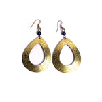 Striking tear-drop brass earrings. Handcrafted with care and attention to detail, these earrings will add a special touch of style and flair to your look.