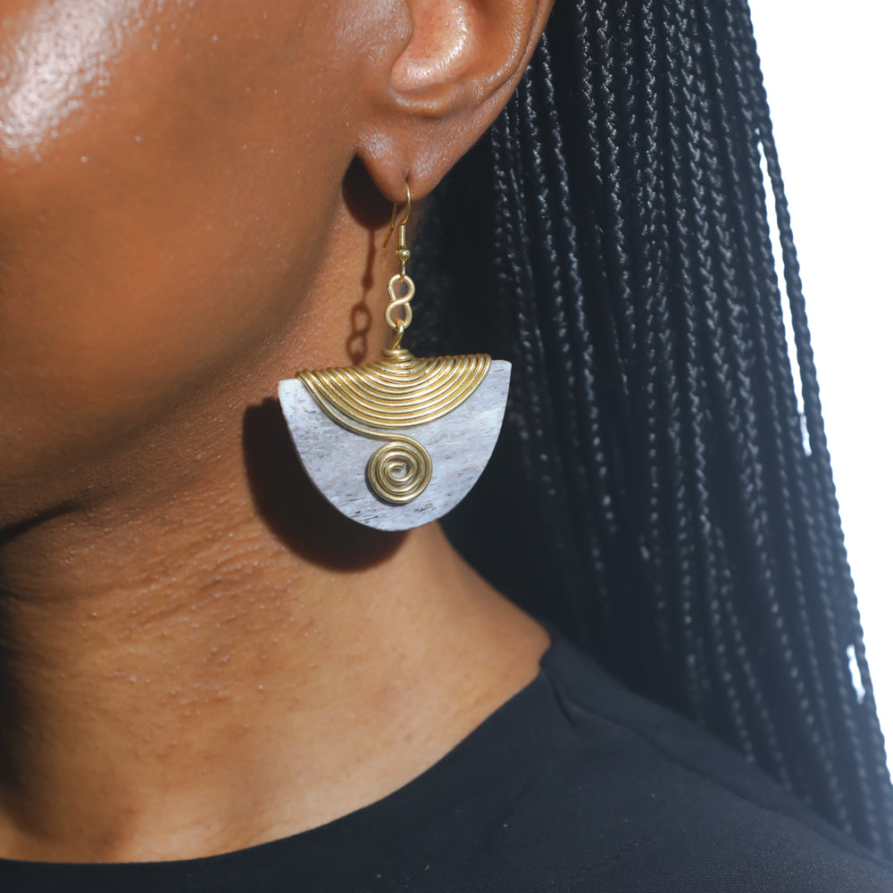The Enzi earrings are handmade with love. They are lightweight and made from repurposed material. Perfect for any occasion. 