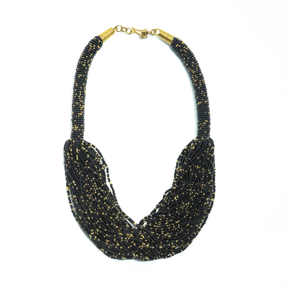 The Kari black and gold beaded necklace is perfect for you! Crafted with unparalleled attention to detail, a statement piece that exudes African-inspired glamor.