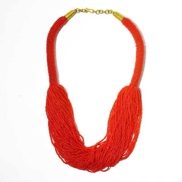 The Kari red beaded necklace is perfect for you! Crafted with unparalleled attention to detail, a statement piece that exudes African-inspired glamor.