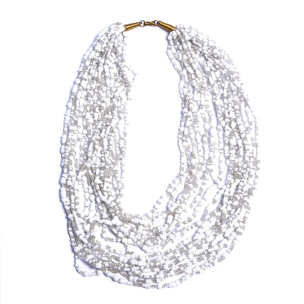 Strung with 20 individual strands of glass seed beads to create this cascading splash of color. The various bead sizes give the Lani an interesting texture that will turn heads every time you wear it. Pair it with a white t-shirt and jeans for an effortless look.