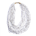 Strung with 20 individual strands of glass seed beads to create this cascading splash of color. The various bead sizes give the Lani an interesting texture that will turn heads every time you wear it. Pair it with a white t-shirt and jeans for an effortless look.