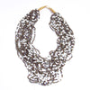 Strung with 20 individual strands of glass seed beads to create this cascading splash of color. The various bead sizes give the Lani an interesting texture that will turn heads every time you wear it. Pair it with a white t-shirt and jeans for an effortless look.
