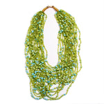 Strung with 20 individual strands of glass seed beads to create this cascading splash of color. The various bead sizes give the Lani an interesting texture that will turn heads every time you wear it. Pair it with a white t-shirt and jeans for an effortless look.