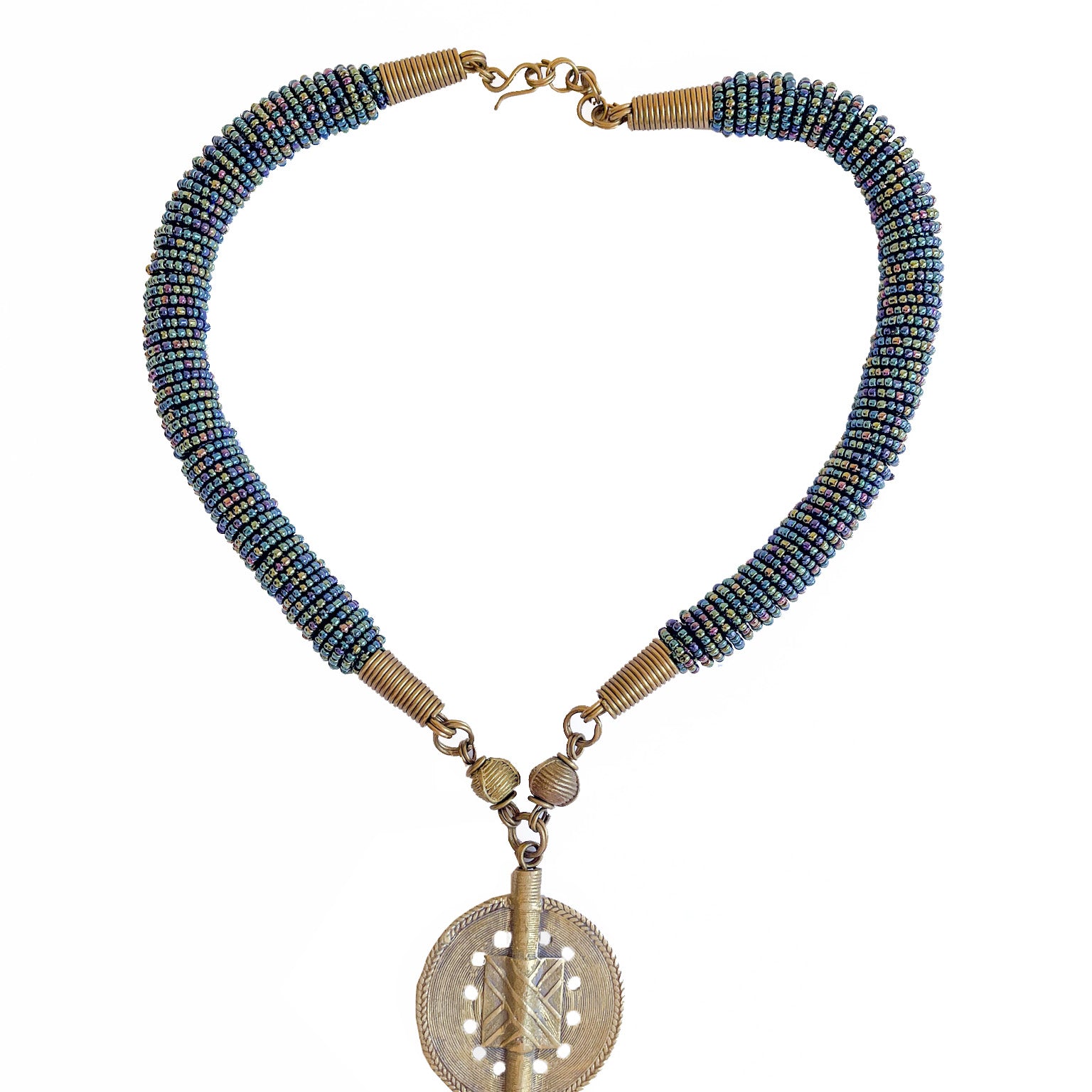 With gorgeous blue beads reminiscent of the ocean. This stunning Mila beaded necklace perfectly combined with a brass baule bead is unique and one-of-a-kind. Get ready to make a show stopping statement.