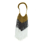 A celebration of color and beadwork. Each bead is strung by hand, creating a joyful dance of cascading beads. A versatile statement necklace that can be worn with a  t-shirt and jeans or dressed up for a dinner date.