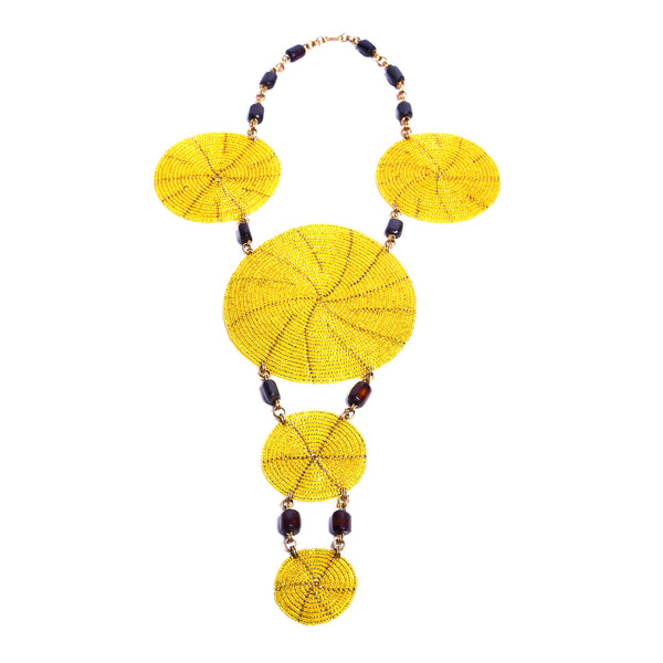 Eye-catching handcrafted statement necklace. Each bead is intricately strung by hand. Truly unique and one-of-a-kind African necklace.The yellow is gorgeous.