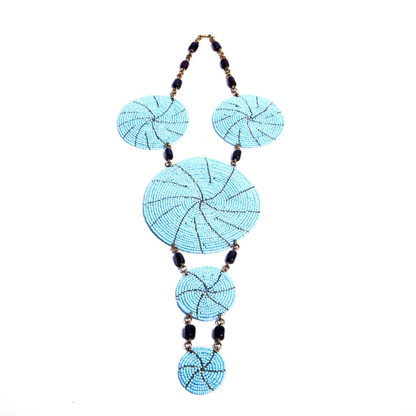 Eye-catching handcrafted statement necklace in this gorgeous sky blue. Each bead is intricately strung by hand. Truly unique and one-of-a-kind African necklace.