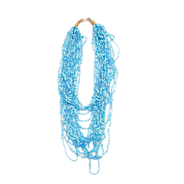 Strung with 20 individual strands of glass seed beads to create this cascading splash of color. The various bead sizes give the Lani an interesting texture that will turn heads every time you wear it. Pair it with a white t-shirt and jeans for an effortless look.